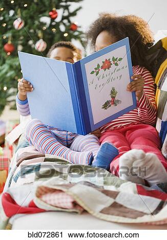 African American brother and sister reading Christmas book View Large Photo Image Stock Image - African American brother and sister reading Christmas book. Fotosearch