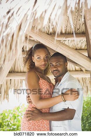 African American couple hugging in grass hut View Large Photo Image Stock Image - African American couple hugging in grass hut. Fotosearch