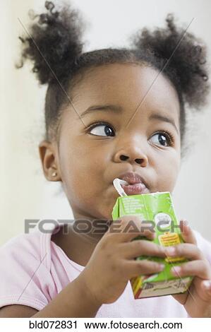 African American girl drinking juicebox View Large Photo Image Stock Image - African American girl drinking juicebox. Fotosearch