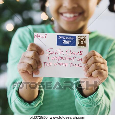 African American girl holding letter to Santa Claus View Large Photo Image Stock Image - African American girl holding letter to Santa Claus. Fotosearch