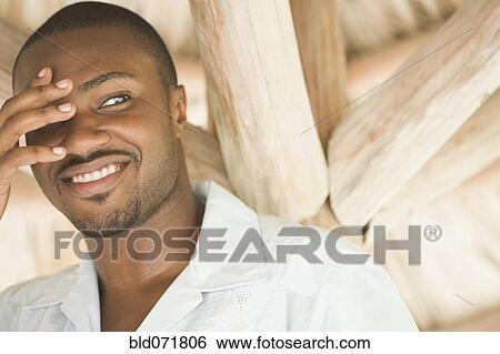 African American man with hand covering eye View Large Photo Image Stock Photograph - African American man with hand covering eye. Fotosearch