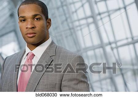 African businessman looking at camera View Large Photo Image Stock Image - African businessman looking at camera. Fotosearch