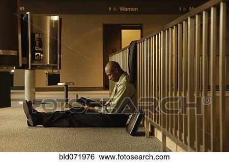 Stock Photograph - African businessman reading book. Fotosearch