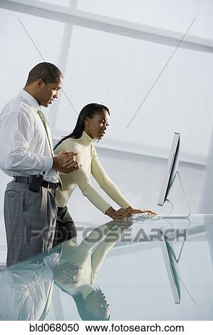 African businesspeople using computer View Large Photo Image Stock Image - African businesspeople using computer. Fotosearch