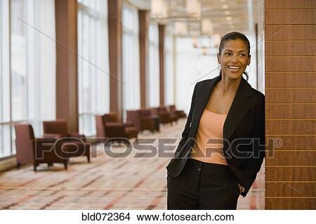 African businesswoman laughing in lobby View Large Photo Image Picture - African businesswoman laughing in lobby. Fotosearch