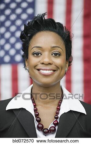African businesswoman standing near American flag View Large Photo Image Stock Image - African businesswoman standing near American flag. Fotosearch