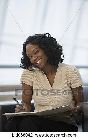 African businesswoman talking on cell phone View Large Photo Image Stock Image - African businesswoman talking on cell phone. Fotosearch
