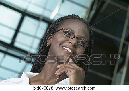 Stock Photo - African businesswoman wearing eyeglasses. Fotosearch