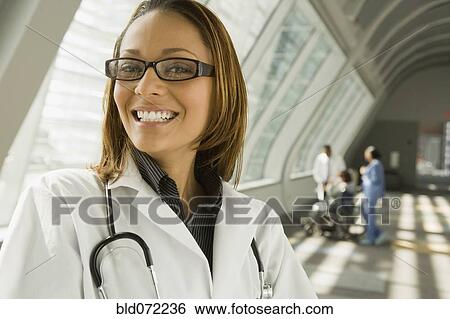 Stock Photograph - African doctor smiling in corridor. Fotosearch