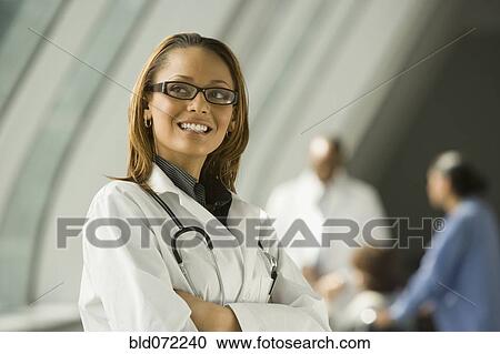 African doctor with arms crossed smiling View Large Photo Image Stock Image - African doctor with arms crossed smiling. Fotosearch