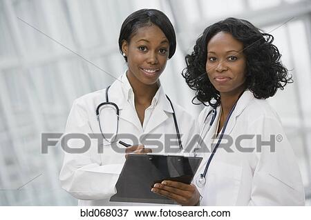Stock Photo - African doctors holding medical chart. Fotosearch
