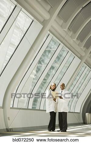 Stock Image - African doctors posing in corridor. Fotosearch