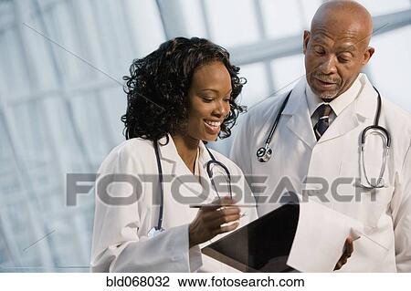 African doctors reviewing medical chart View Large Photo Image Stock Image - African doctors reviewing medical chart. Fotosearch