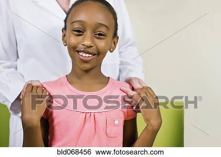 African girl holding hands with woman View Large Photo Image Stock Photograph - African girl holding hands with woman. Fotosearch