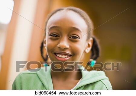 Picture - African girl smiling. Fotosearch