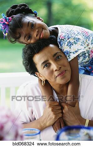 African grandmother and granddaughter hugging View Large Photo Image Picture - African grandmother and granddaughter hugging. Fotosearch
