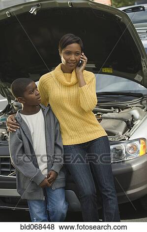African mother and son having car trouble View Large Photo Image Stock Photo - African mother and son having car trouble. Fotosearch