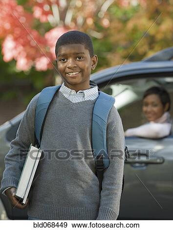 African mother dropping son off at school View Large Photo Image Stock Photo - African mother dropping son off at school. Fotosearch