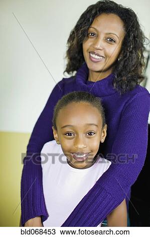 African mother hugging daughter View Large Photo Image Stock Image - African mother hugging daughter. Fotosearch