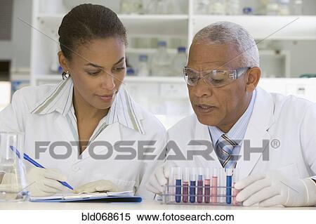 Stock Photography - African scientists performing analysis in laboratory. Fotosearch