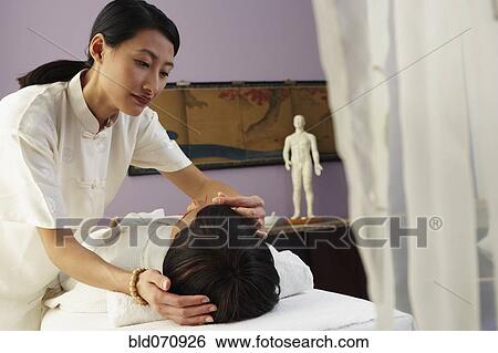 African woman receiving Acupuncture treatment View Large Photo Image Stock Photograph - African woman receiving Acupuncture treatment. Fotosearch