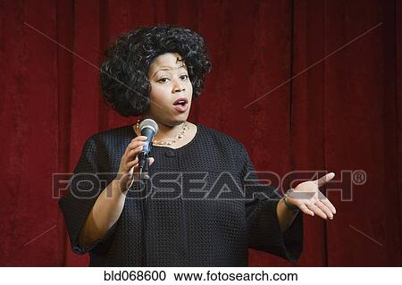 African woman singing on stage View Large Photo Image Stock Image - African woman singing on stage. Fotosearch