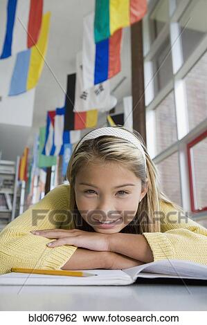 Stock Image - Asian girl studying. Fotosearch