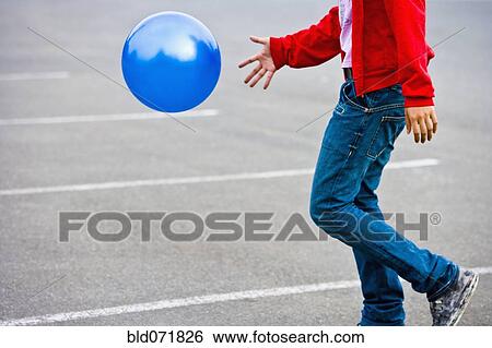 Asian man bouncing ball View Large Photo Image Stock Photograph - Asian man bouncing ball. Fotosearch