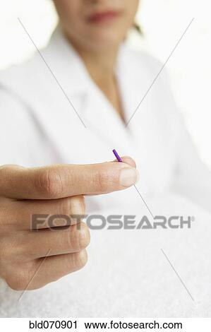 Asian woman holding Acupuncture needle View Large Photo Image Stock Image - Asian woman holding Acupuncture needle. Fotosearch