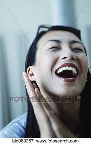 Asian woman laughing View Large Photo Image Stock Photo - Asian woman laughing. Fotosearch