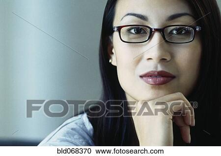 Asian woman wearing eyeglasses View Large Photo Image Stock Image - Asian woman wearing eyeglasses. Fotosearch