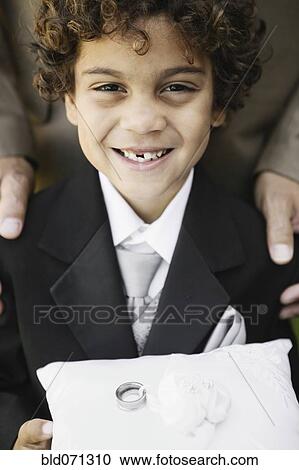 Boy as ring bearer at wedding View Large Photo Image Stock Image - Boy as ring bearer at wedding. Fotosearch