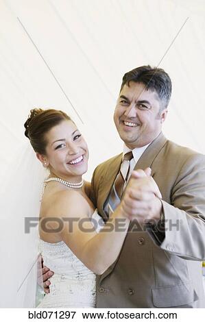 Stock Photo - Bride dancing with father at wedding. Fotosearch
