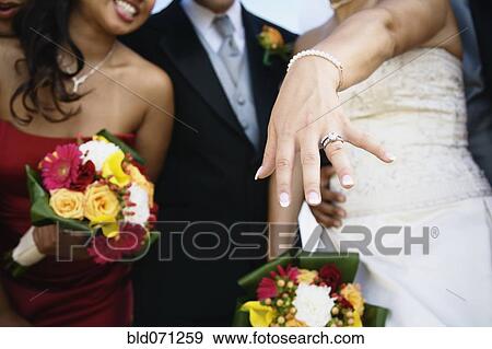 Stock Photo - Bride showing off ring. Fotosearch