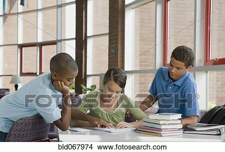 Picture - Classmates studying together. Fotosearch