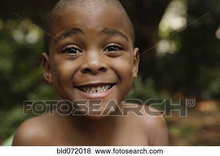 Close up of African American boy smiling View Large Photo Image Stock Photo - Close up of African American boy smiling. Fotosearch