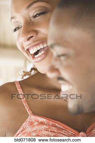 Close up of African American couple laughing View Large Photo Image Stock Photo - Close up of African American couple laughing. Fotosearch