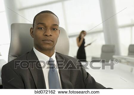 Close up of African businessman in conference room View Large Photo Image Stock Image - Close up of African businessman in conference room. Fotosearch