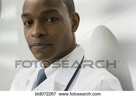 Stock Photo - Close up of African doctor looking serious. Fotosearch