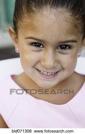 Close up of girl smiling View Large Photo Image Stock Photo - Close up of girl smiling. Fotosearch