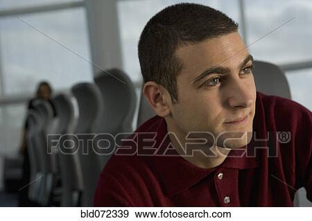 Stock Photo - Close up of mixed race businessman in conference room. Fotosearch