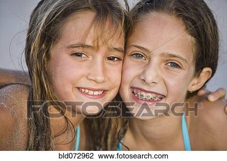 Close up of smiling Hispanic girls View Large Photo Image Stock Image - Close up of smiling Hispanic girls. Fotosearch