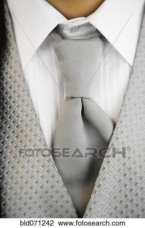 Stock Image - Close up of tuxedo tie and vest. Fotosearch