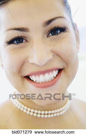Close up of woman smiling View Large Photo Image Stock Photo - Close up of woman smiling. Fotosearch
