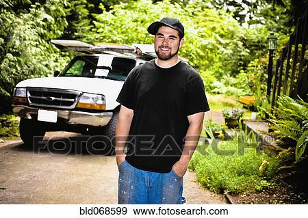 Stock Photo - Construction worker standing outdoors. Fotosearch