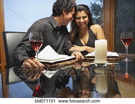 Couple hugging at table View Large Photo Image Stock Image - Couple hugging at table. Fotosearch