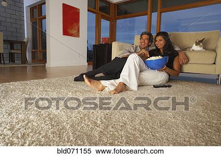 Stock Photography - Couple watching television. Fotosearch