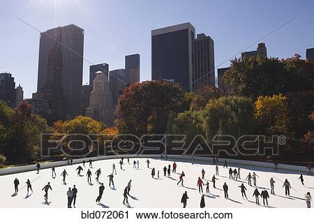 Crowd of people ice skating in urban skating rink View Large Photo Image Stock Image - Crowd of people ice skating in urban skating rink. Fotosearch