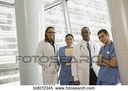 Stock Photography - Doctor and nurse eating fruit. Fotosearch