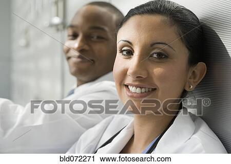 Stock Image - Doctors smiling. Fotosearch